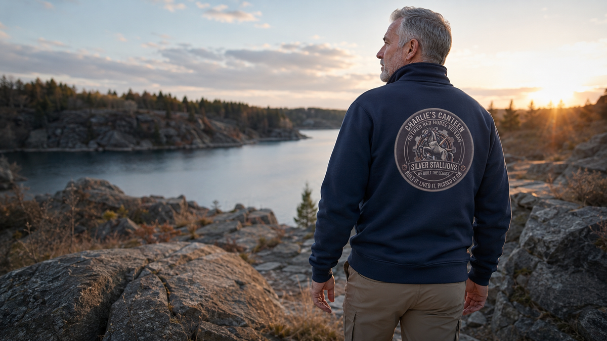 Silver Stallions half-zip pullover worn at a rugged lakeside overlook
